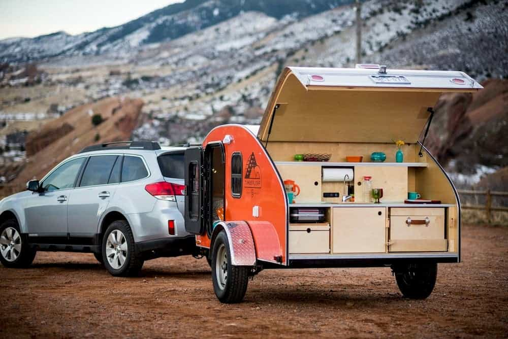 Orange tailer with mountains in background