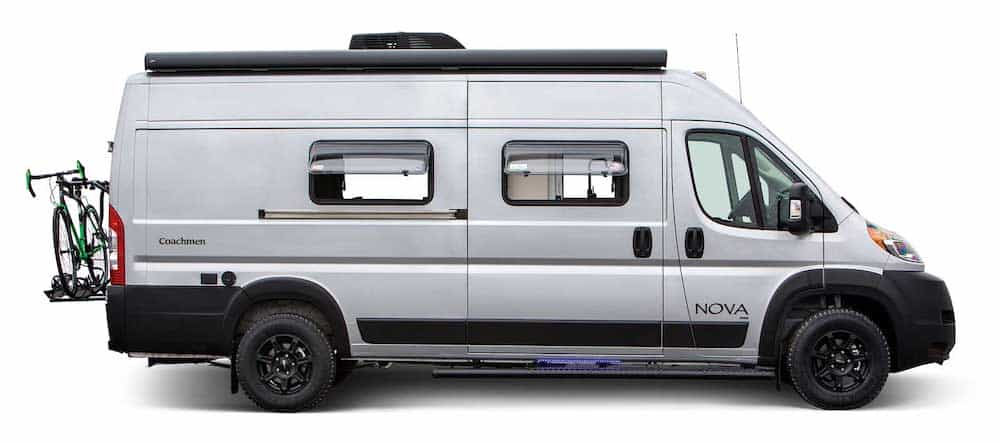 Exterior side view of a white Xcursion campervan by Fleetwood RV