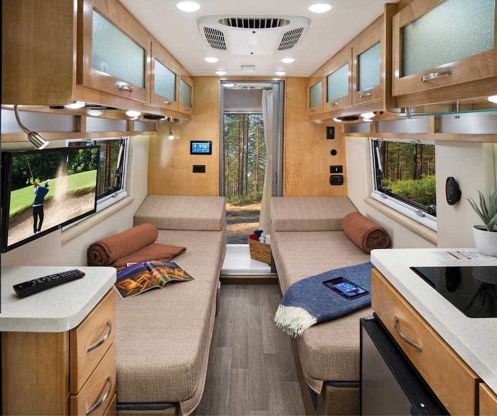 Interior view of the Fleetwood RV 2024 Xcursion Class B RV showing the kitchen and seating area